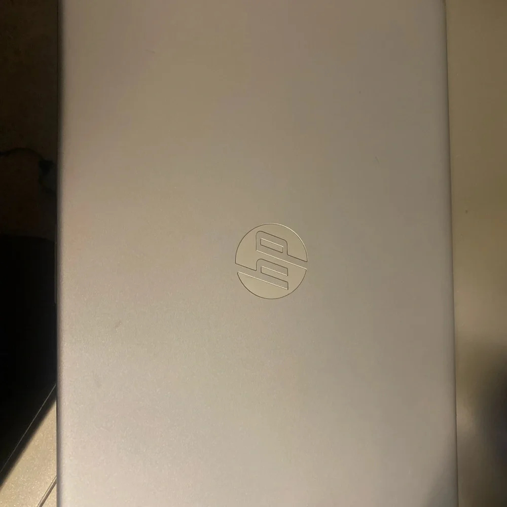 Barley used HP Silver Laptop with Charger.